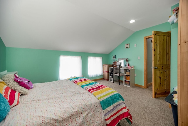 carpeted bedroom featuring lofted ceiling