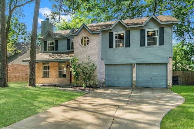 view of front facade with a garage and a front lawn