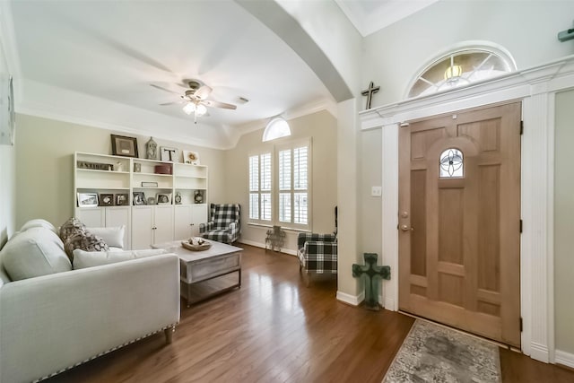 entryway featuring crown molding, dark hardwood / wood-style floors, and ceiling fan