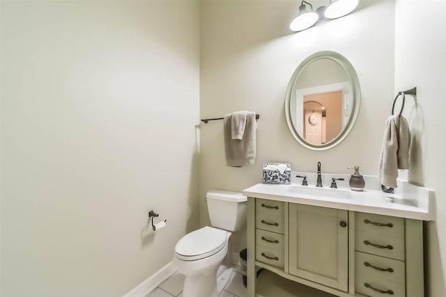 bathroom with vanity, tile patterned flooring, and toilet