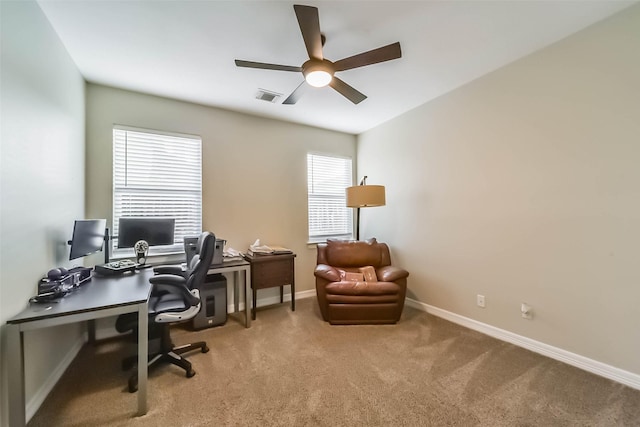 carpeted office with ceiling fan