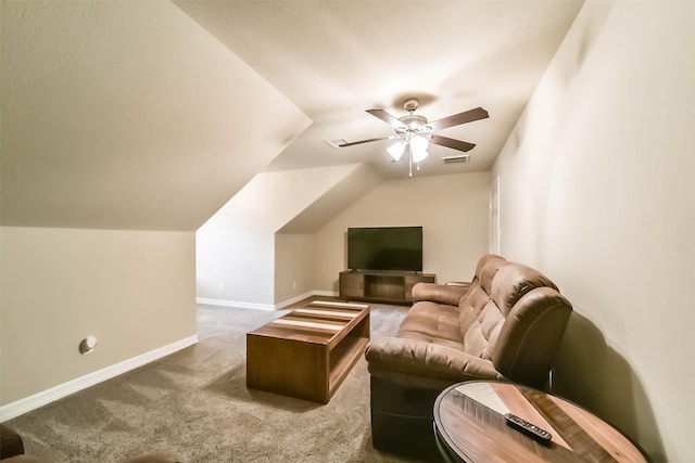 interior space with vaulted ceiling, carpet, and ceiling fan