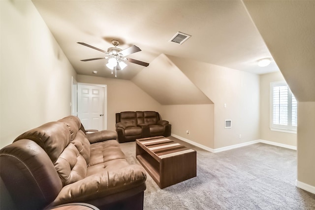 living room with vaulted ceiling, light colored carpet, and ceiling fan