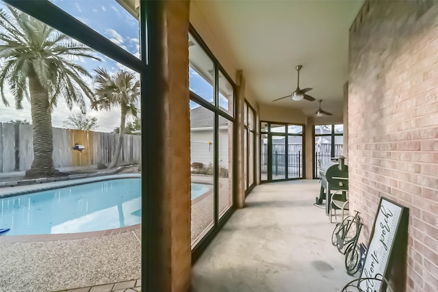 sunroom / solarium with ceiling fan