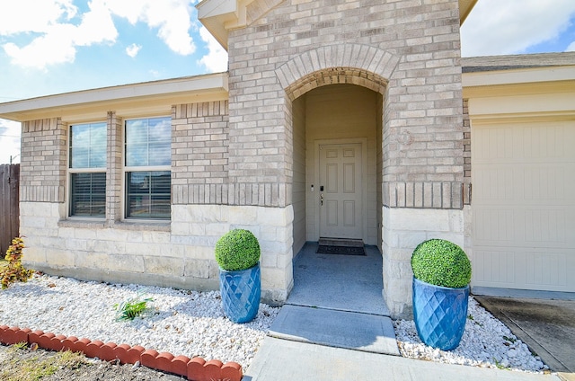 entrance to property featuring a garage