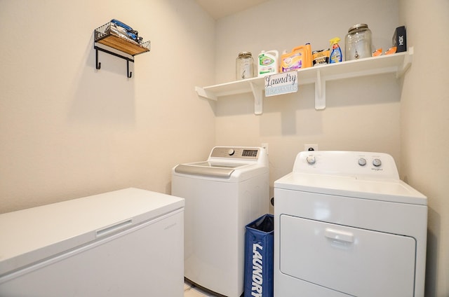 washroom featuring washer and dryer