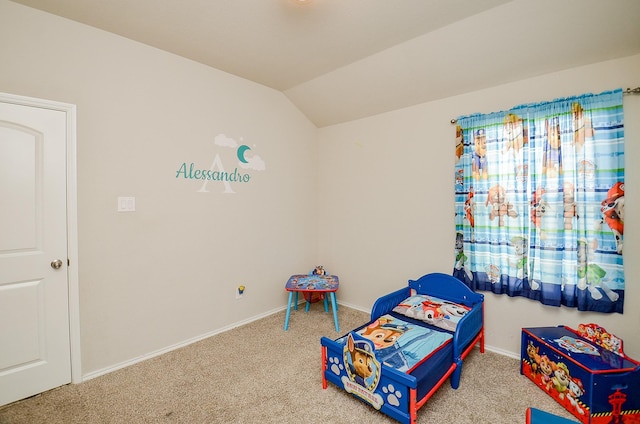 playroom featuring lofted ceiling and carpet flooring