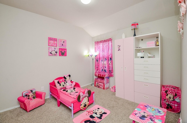 bedroom with vaulted ceiling and carpet