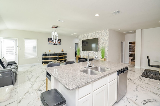 kitchen with sink, a center island with sink, stainless steel dishwasher, light stone countertops, and white cabinets