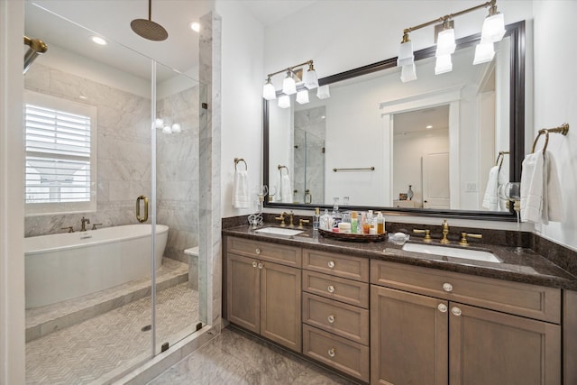 bathroom featuring vanity and separate shower and tub