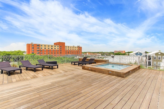 wooden deck featuring an in ground hot tub