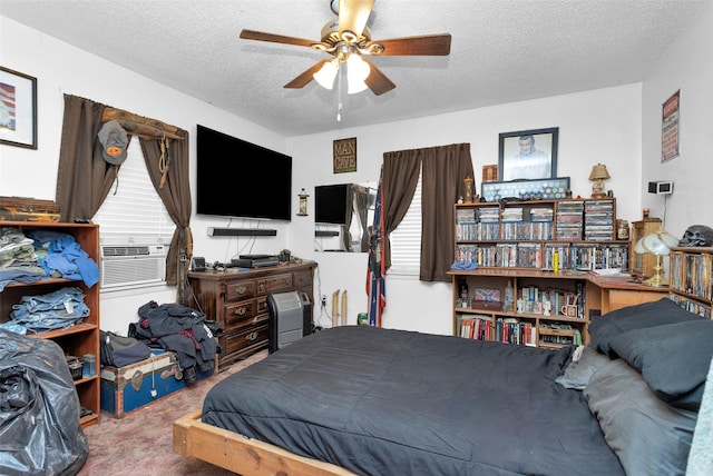 carpeted bedroom featuring cooling unit and a textured ceiling