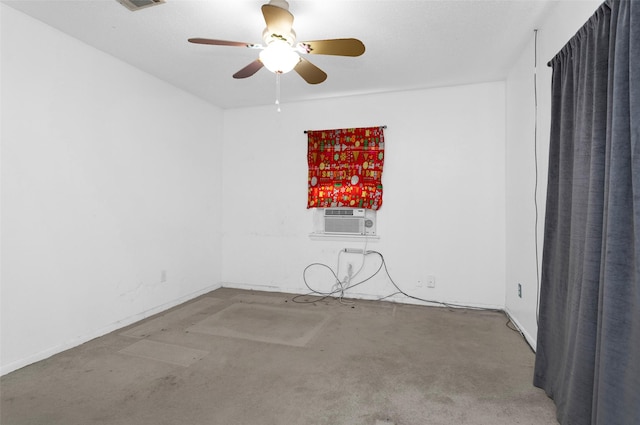 unfurnished room with cooling unit and ceiling fan