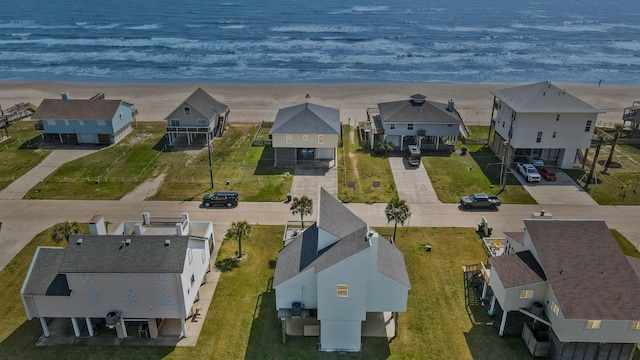 aerial view featuring a water view and a beach view