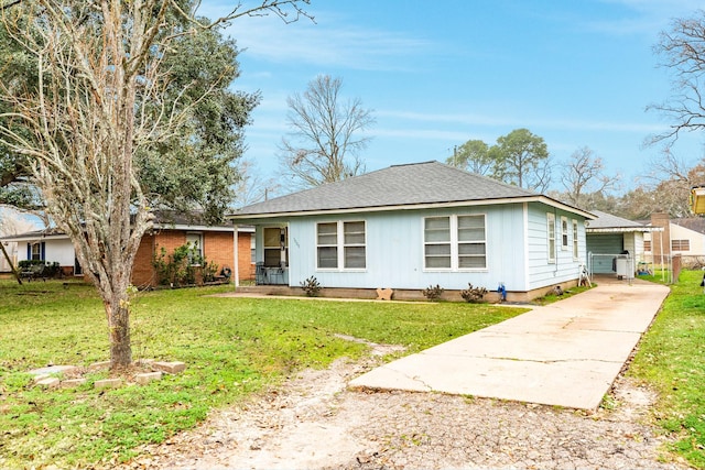 ranch-style home with a front lawn