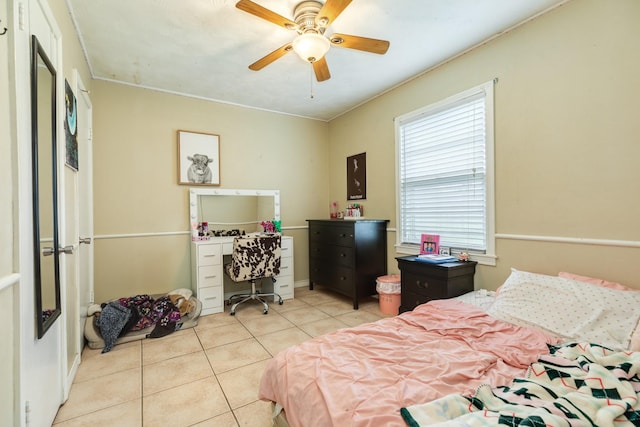 bedroom with ceiling fan and light tile patterned flooring