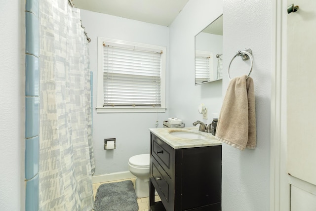 bathroom with vanity, tile patterned floors, toilet, and a shower with shower curtain