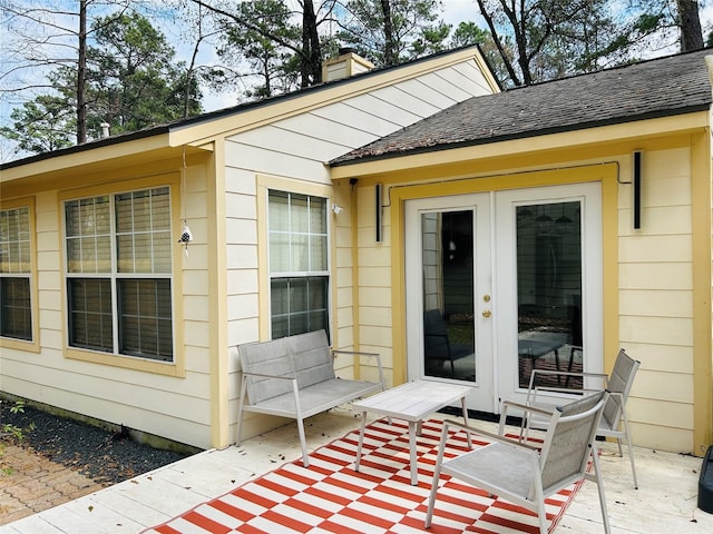 entrance to property featuring french doors and a patio area