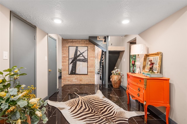 interior space with a textured ceiling