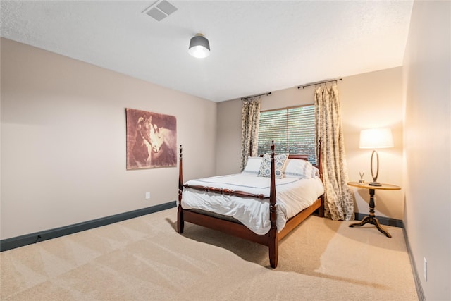 carpeted bedroom with a textured ceiling