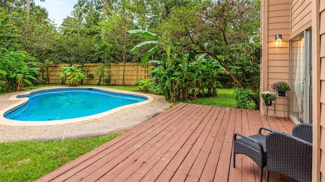 view of swimming pool featuring a deck