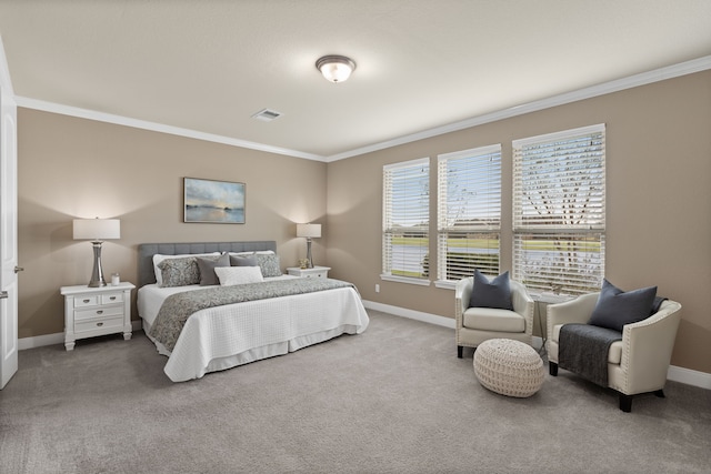 carpeted bedroom featuring crown molding, visible vents, and baseboards