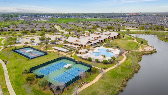 drone / aerial view featuring a water view and a residential view
