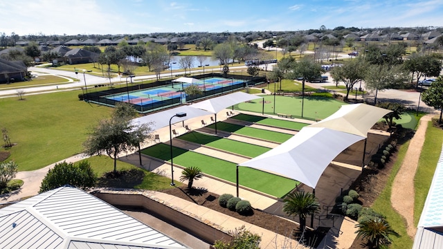 drone / aerial view with a water view and a residential view
