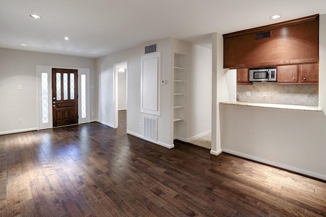 foyer featuring dark hardwood / wood-style floors