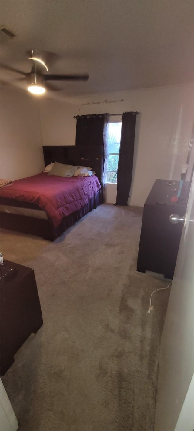 carpeted bedroom featuring ceiling fan