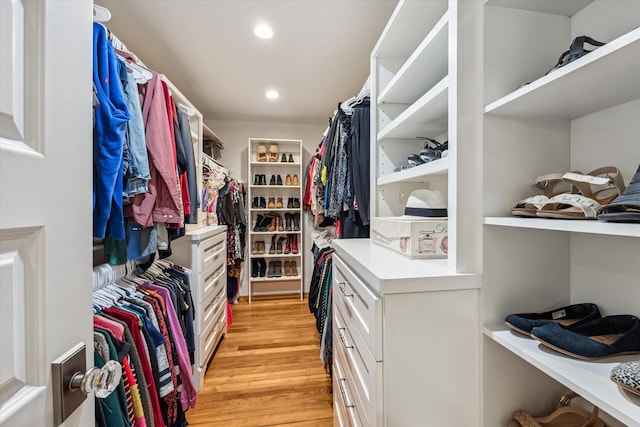 spacious closet with light hardwood / wood-style floors