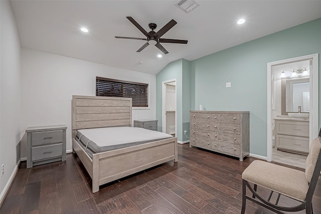 bedroom with ensuite bathroom, sink, vaulted ceiling, dark hardwood / wood-style floors, and ceiling fan