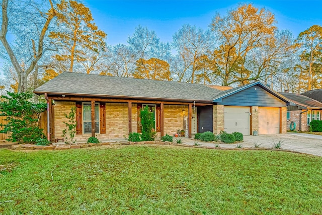 ranch-style home featuring a garage and a front lawn