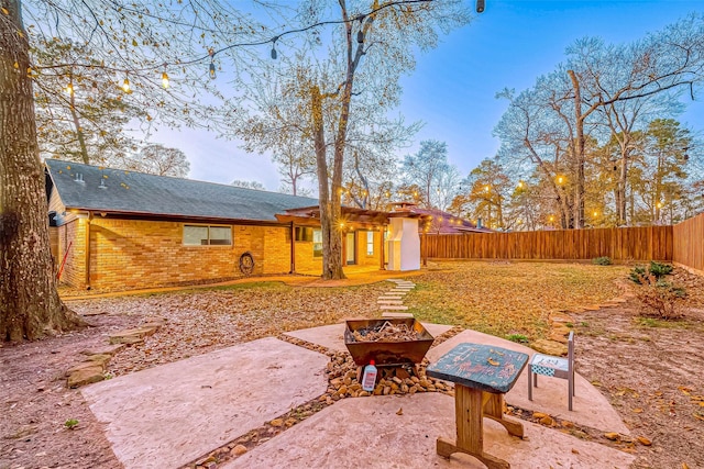 exterior space with a fire pit and a patio area