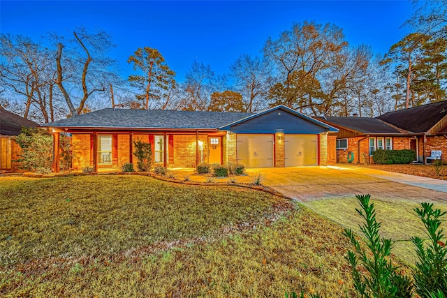 ranch-style home with a garage and a front yard