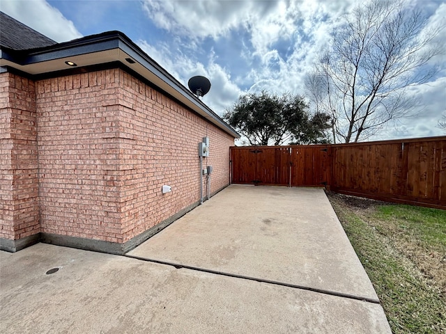 view of side of home featuring a patio area