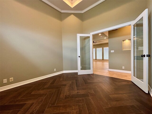 unfurnished room featuring ornamental molding, french doors, and baseboards