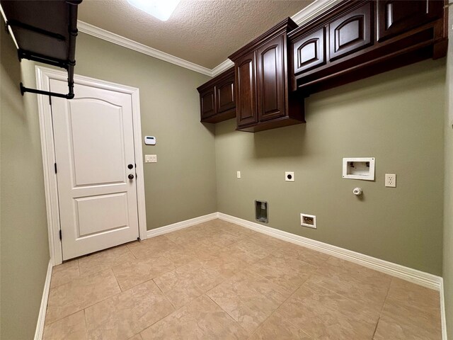 laundry area with hookup for a washing machine, cabinet space, hookup for an electric dryer, gas dryer hookup, and a textured ceiling