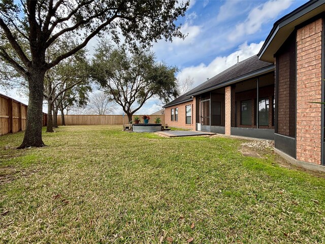 view of yard with a patio and a fenced backyard