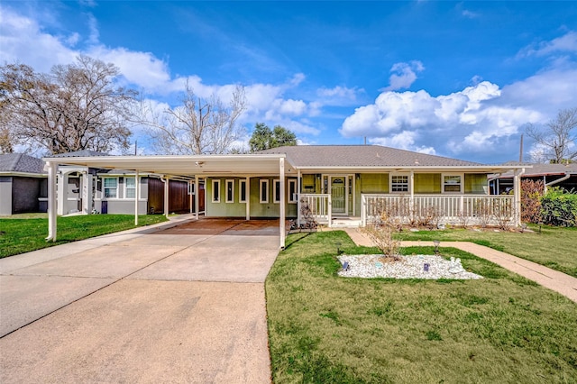 ranch-style home with a carport, a porch, and a front lawn