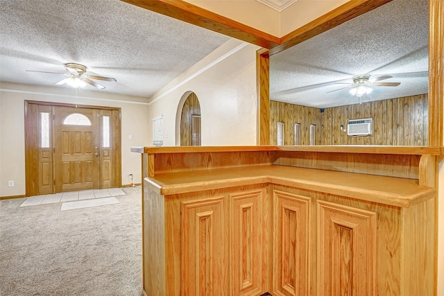 kitchen featuring carpet floors, a textured ceiling, and ceiling fan