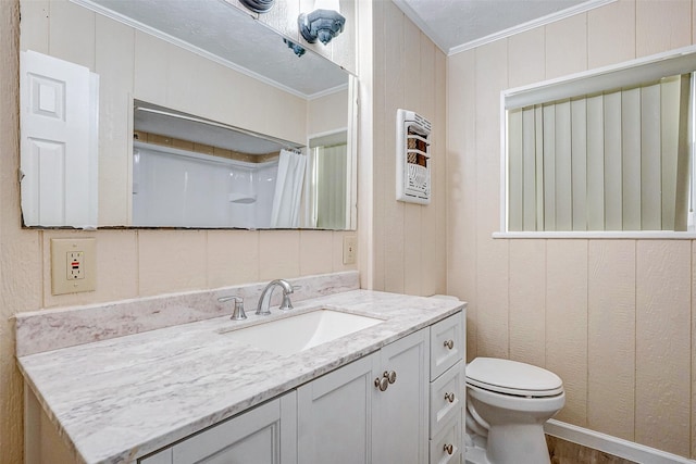 bathroom featuring toilet, ornamental molding, wooden walls, vanity, and a shower with shower curtain