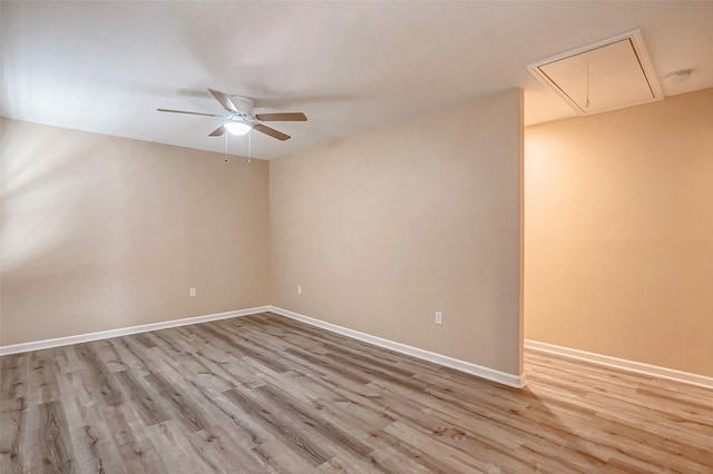 spare room featuring ceiling fan and light wood-type flooring