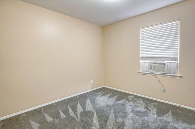 carpeted spare room with cooling unit