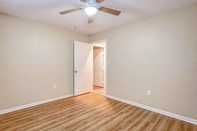 spare room with ceiling fan and light hardwood / wood-style floors