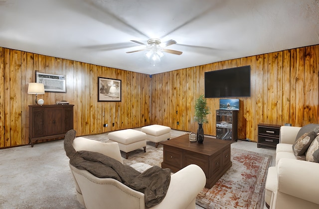 carpeted living room with ceiling fan and a wall mounted air conditioner