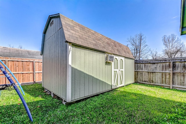 view of outbuilding with a lawn