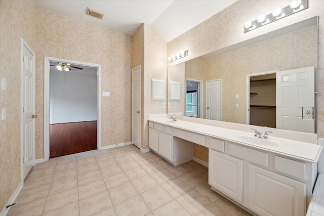 full bath with baseboards, a sink, visible vents, and wallpapered walls