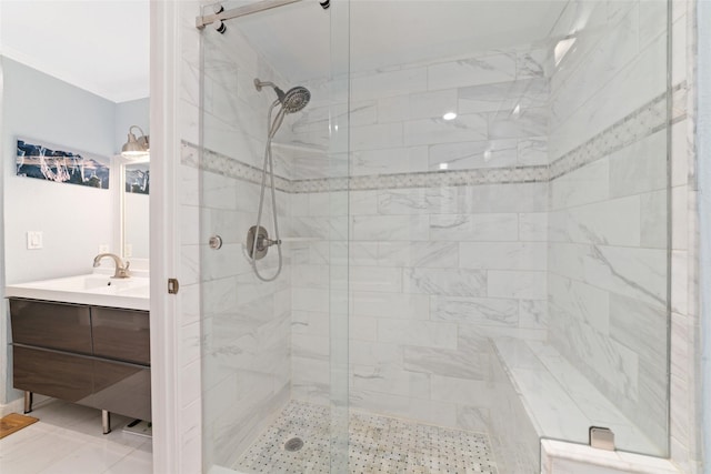 bathroom with vanity, a shower with door, and ornamental molding