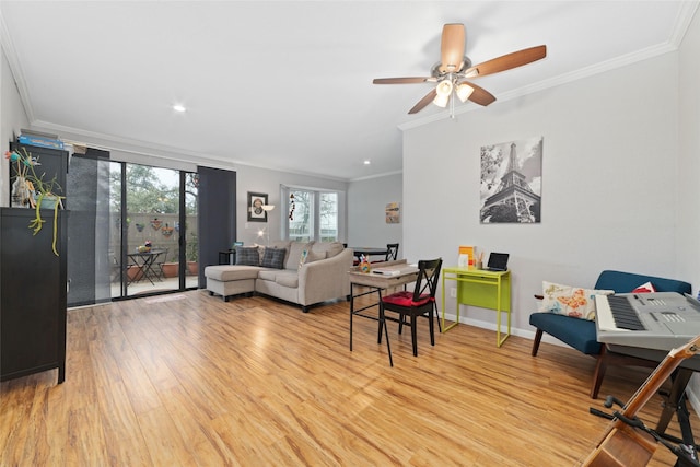 living room featuring light hardwood / wood-style flooring, ornamental molding, and ceiling fan